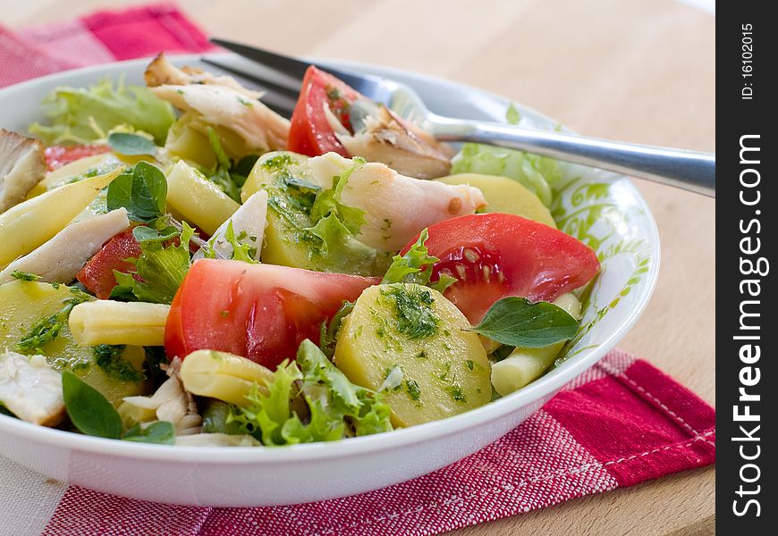 Salad from potatoes, lettuce, tomatoes and beans