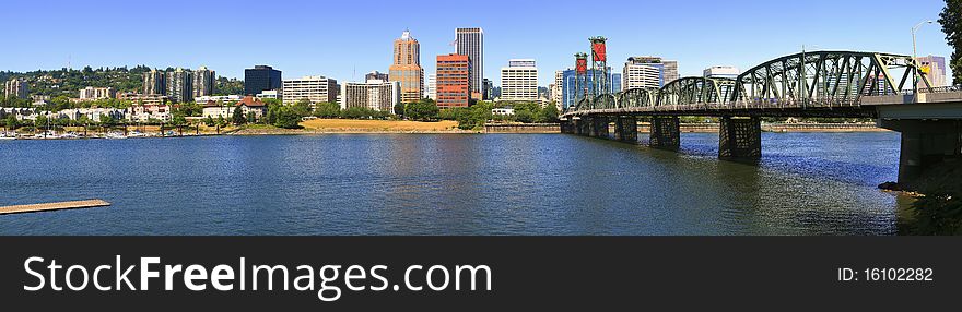 A panoramic view of the city skyline and the Hawthorne bridge overseeing the western hills. A panoramic view of the city skyline and the Hawthorne bridge overseeing the western hills.