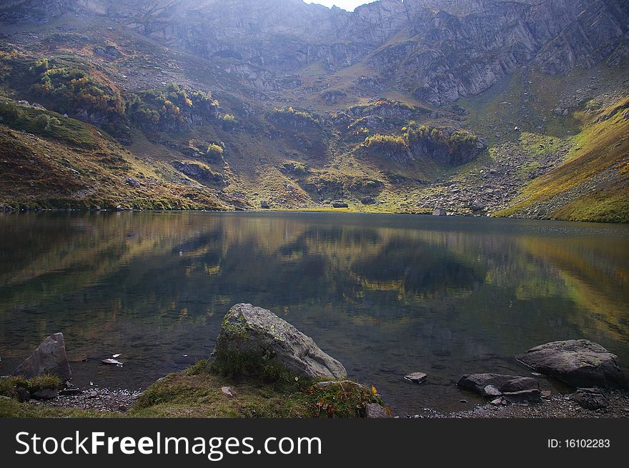 Mountains in the reflection of the lake Mzy. Caucasus. Abkhazia. Mountains in the reflection of the lake Mzy. Caucasus. Abkhazia