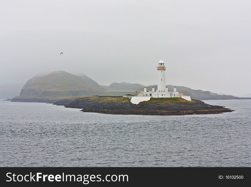 Scottish ligthouse close to Mull Isle, in the fog. Scottish ligthouse close to Mull Isle, in the fog