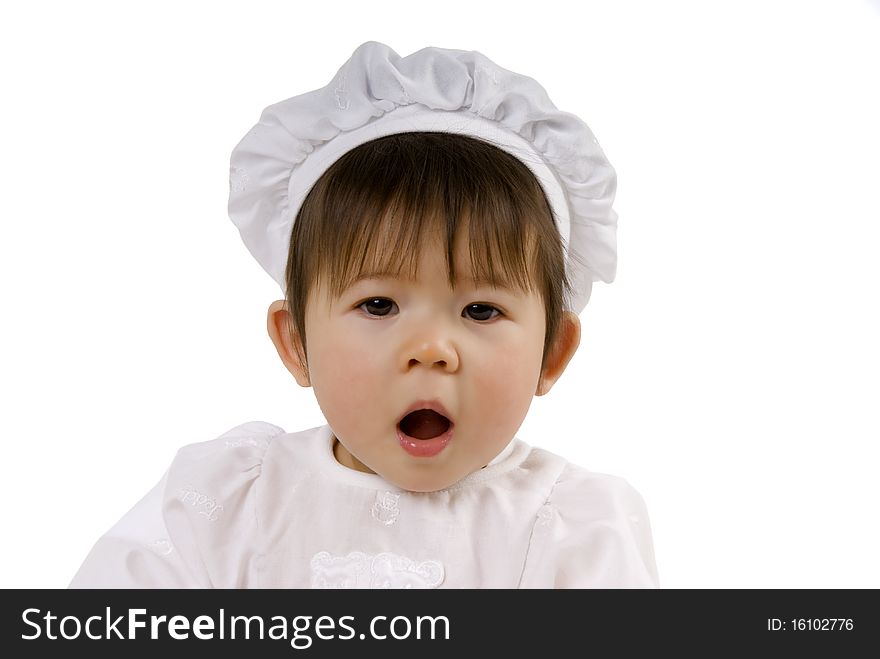 Cute chef baby with brown hair and open mouth