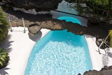 Swimming Pool In Natural Volcanic Rock Area Royalty Free Stock Image