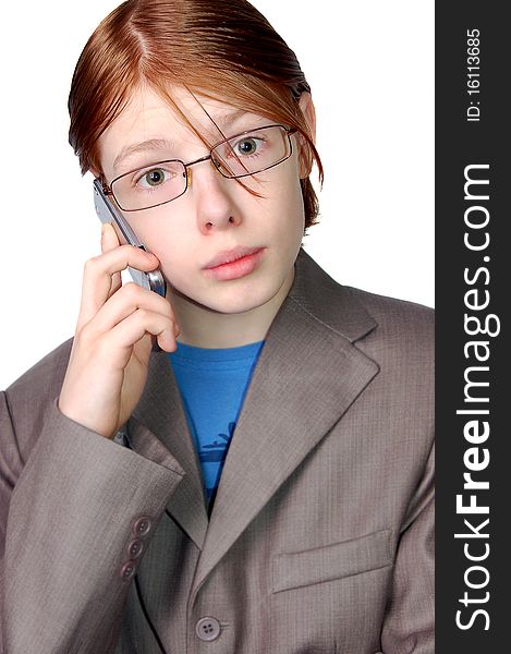 Boy talking on the mobile phone isolated on white background. Boy talking on the mobile phone isolated on white background