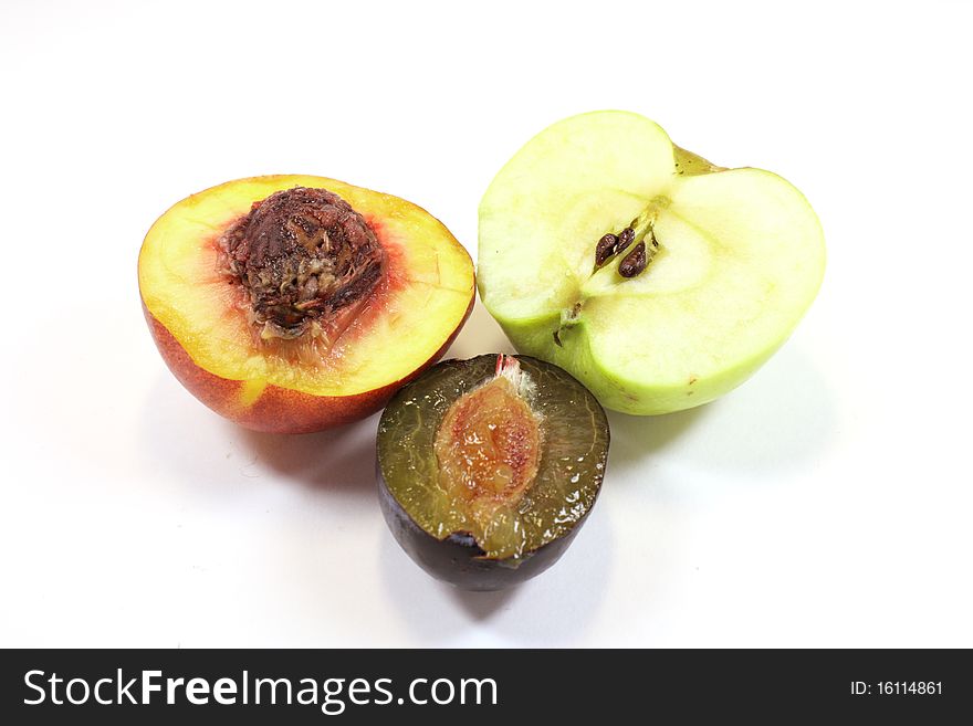 Peachy, apple and plums on a white background. Peachy, apple and plums on a white background