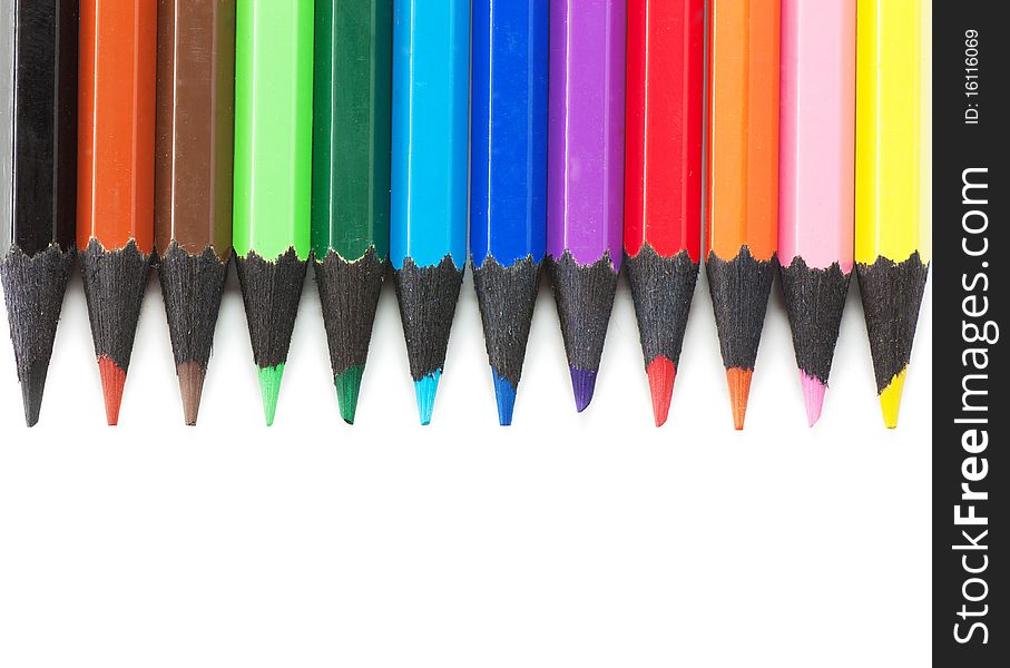 Colored pencils isolated over white background