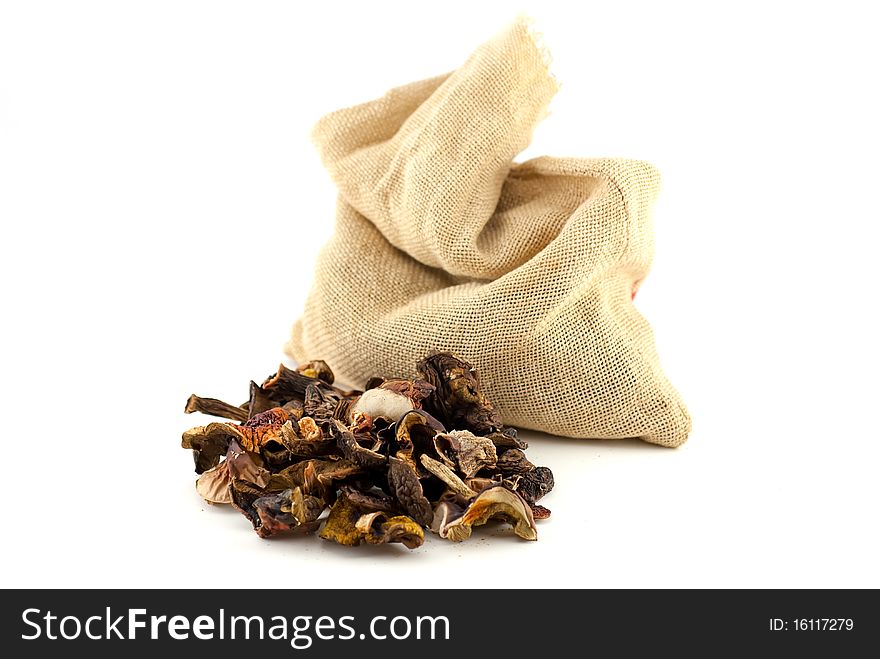 Isolated heap of dry mushrooms on white background