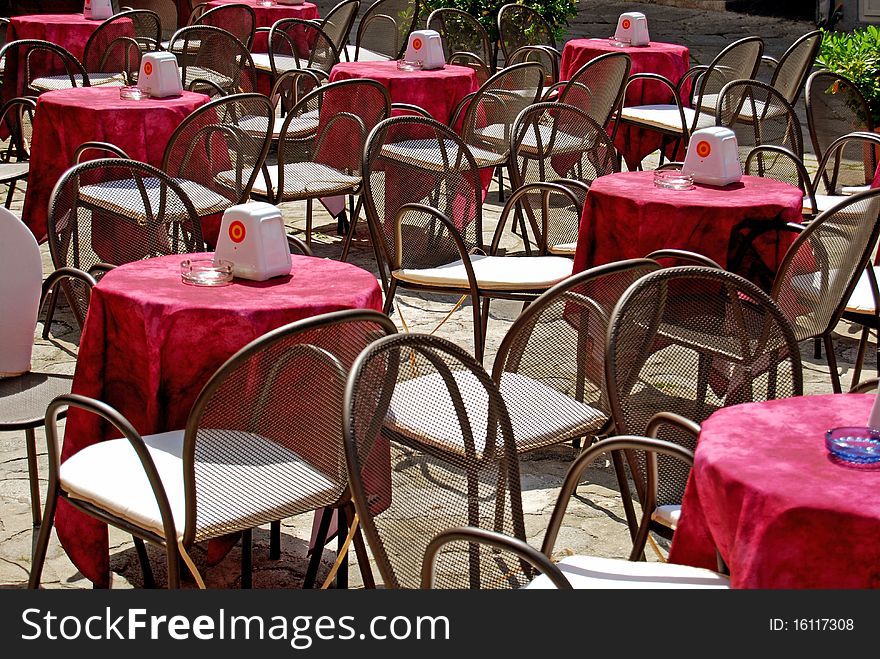 The tables of a cafe in the square in Tropea. The tables of a cafe in the square in Tropea