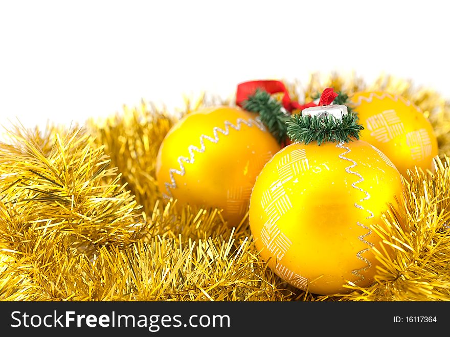 Studio shot of three christmas golden balls isolatedn on white