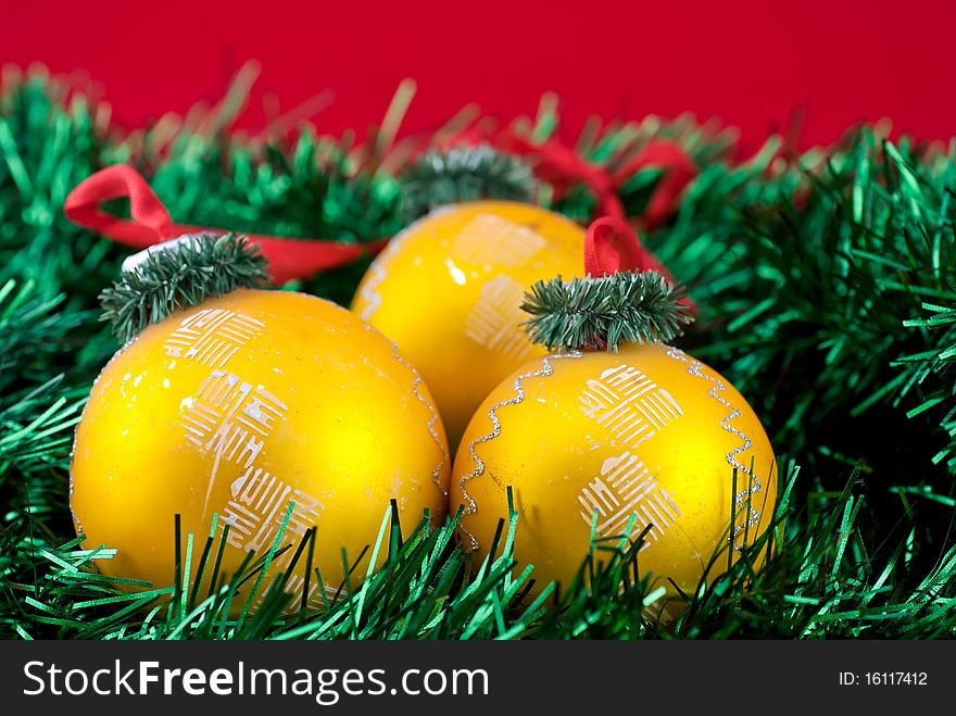 Studio shot of three christmas golden balls isolatedn on white