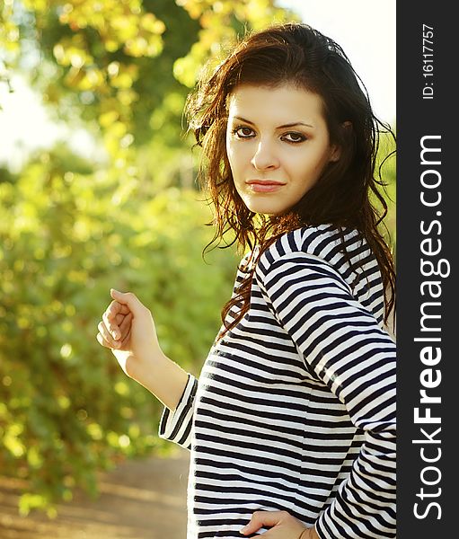 Portrait of pretty young healthy woman running outside
