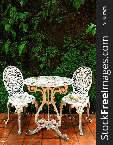 Two white chairs in beautiful garden