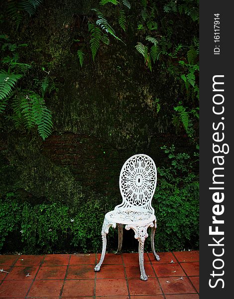 White chair in beautiful garden