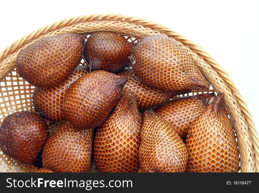 Red Zalacca fruit or snakefruit, Traditional seasonal Sweet fruit flavors of Thailand, in wooden basket