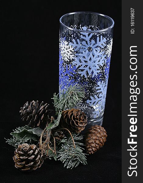 A glass with a branch of pine needles. A glass with a branch of pine needles