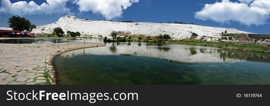 A morning panoramic shot of mountains and a lake. A morning panoramic shot of mountains and a lake.