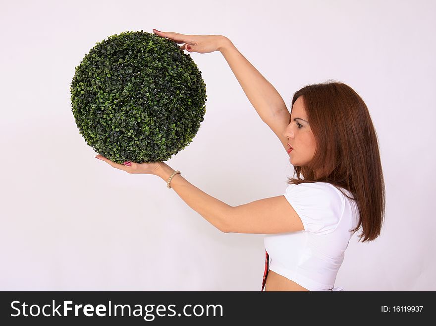 Girl holding the green ball - Ecological methaphore