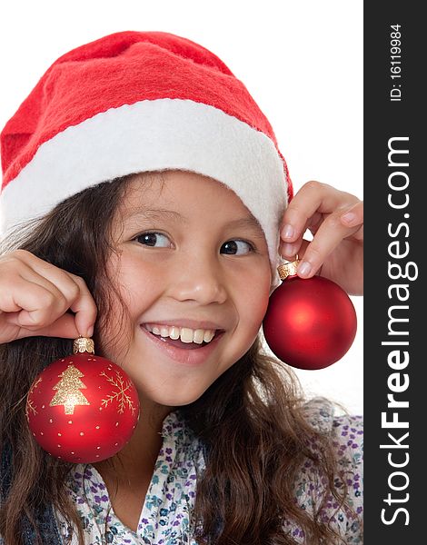 Christmas, charming child with Christmas bonnet and Christmas tree ball before white background