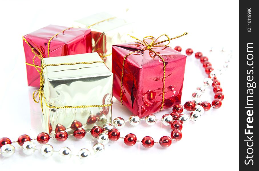 Christmas gifts decoration isolated close up pearls gold red