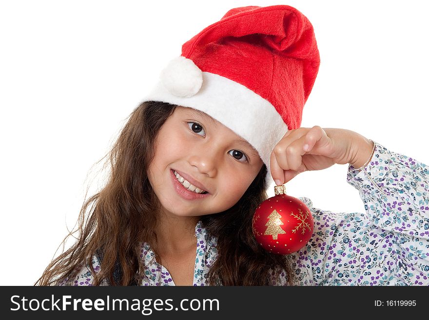 Christmas, charming child with Christmas bonnet and Christmas tree ball before white background