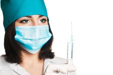 Portrait Of Doctor With Syringe In Hand Royalty Free Stock Image