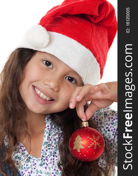 Christmas, charming child with Christmas bonnet and Christmas tree ball before white background