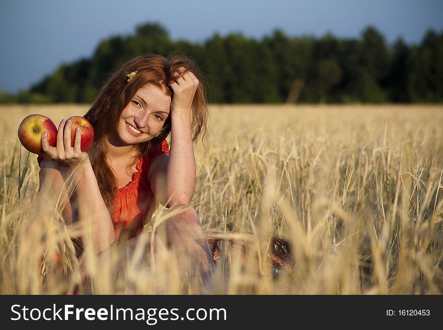 Redhead girl with the apple harvest. Redhead girl with the apple harvest