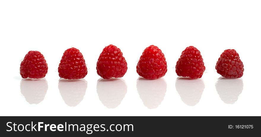 Red raspberry with reflection isolated on white