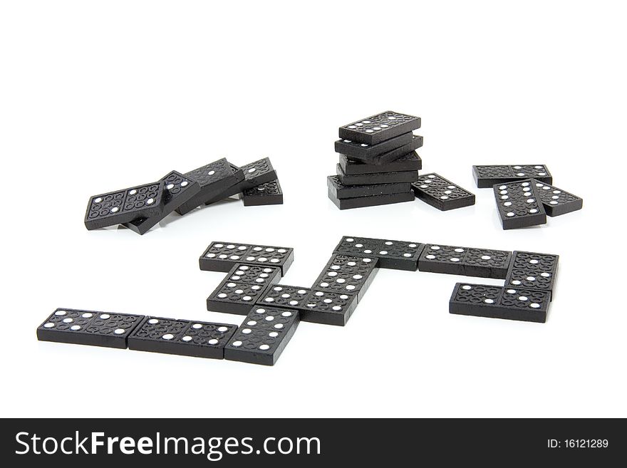 Black domino stones isolated over white