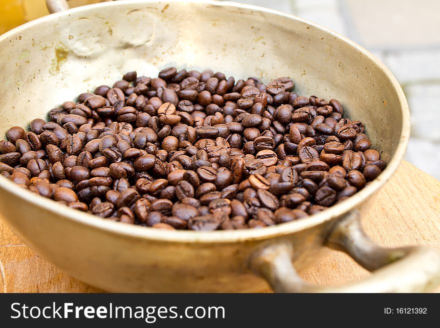 Coffee beans in a vintage bowl (shallow DOF)