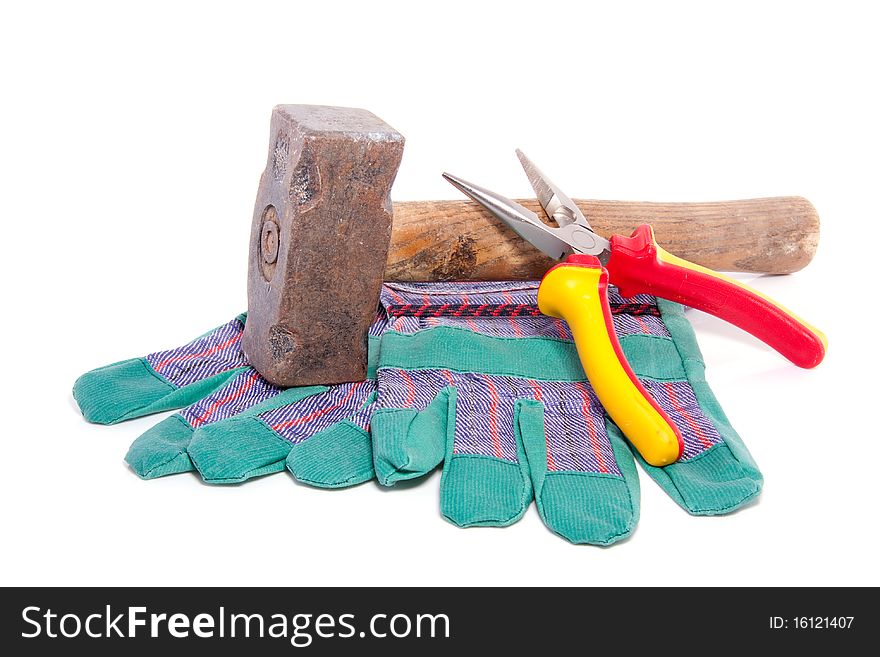 Working gloves and carpenter tools isolated over white background. Working gloves and carpenter tools isolated over white background
