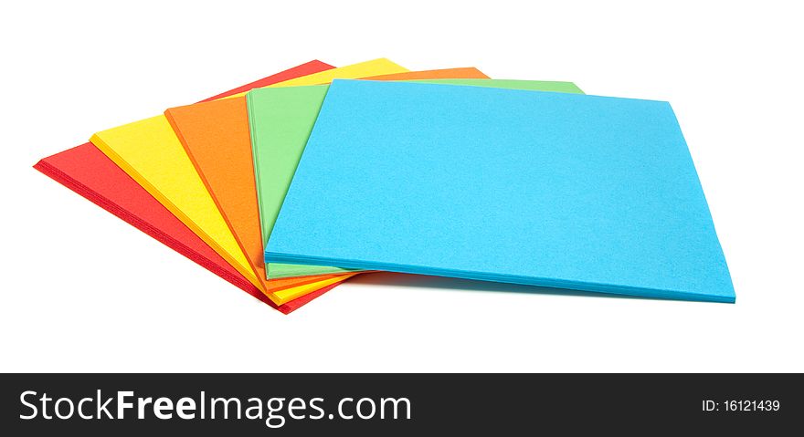 A fan of colorful folding leaves isolated over white