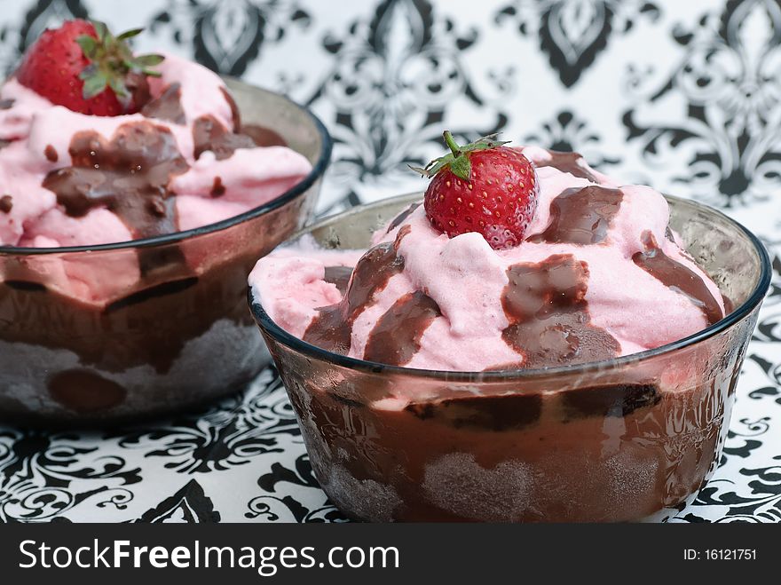 Homemade strawberry icecream with chocalate topping on b/w background