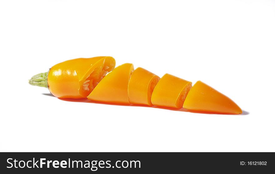 Sliced, yellow chili pepper isolate on a white background. Sliced, yellow chili pepper isolate on a white background