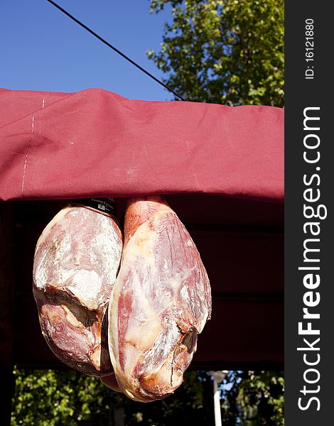 Exposed ham hanging in a stall