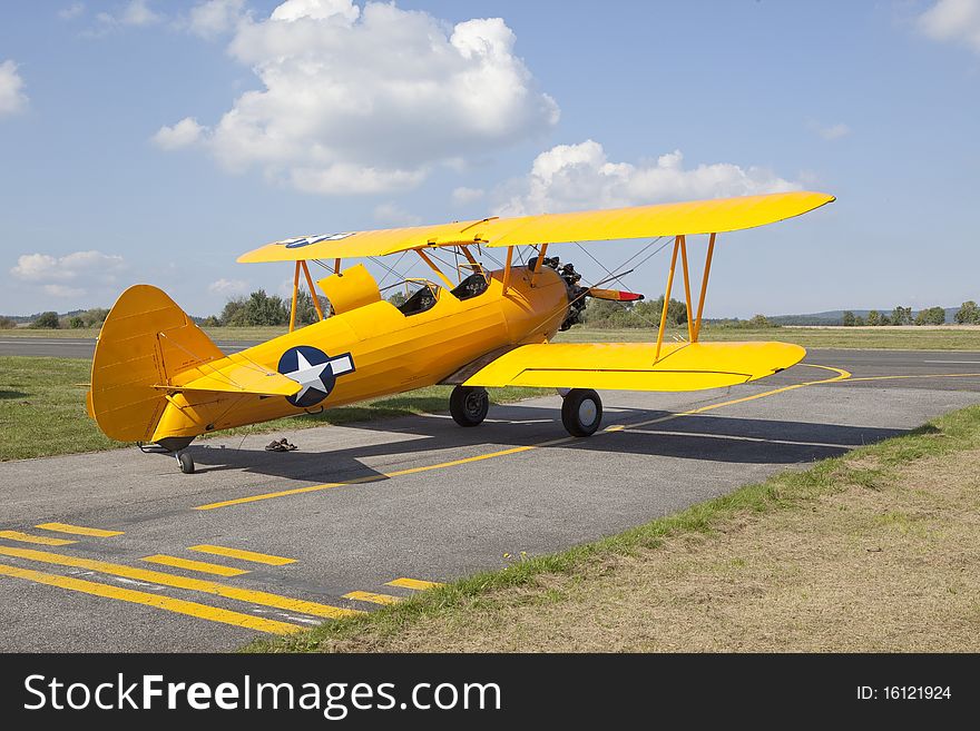 Old yellow biplane before trip