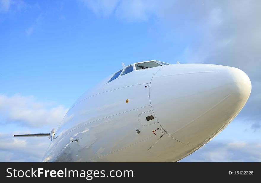 White passenger airplane, cockpit, view with a side. White passenger airplane, cockpit, view with a side