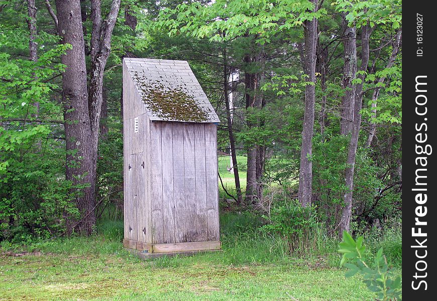Wooden Outhouse building in the woods. Wooden Outhouse building in the woods