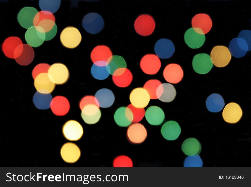 Blurred Cristmas light in isolated over black background. Blurred Cristmas light in isolated over black background