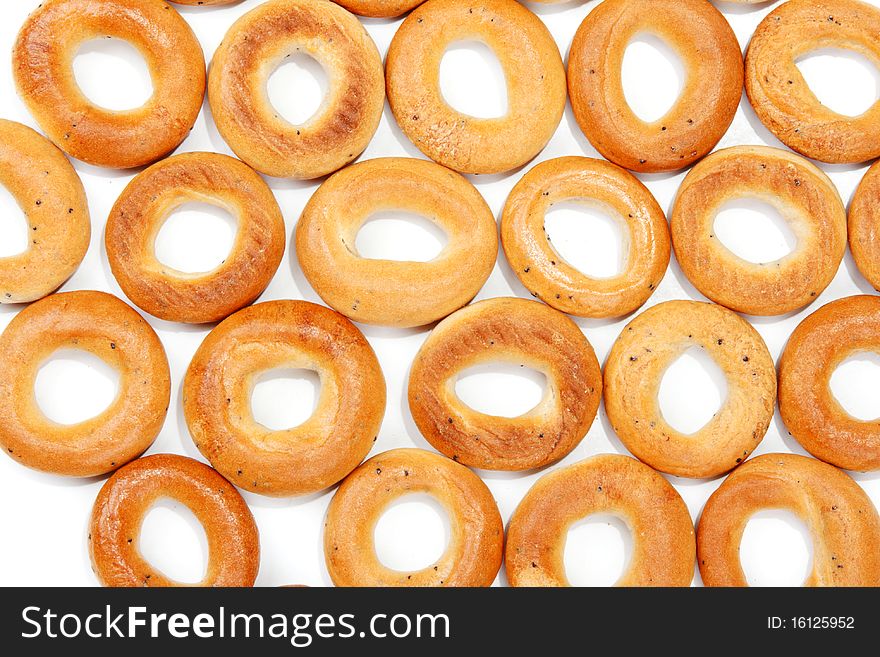 Tasty bagels put in the manner of background on white sheet