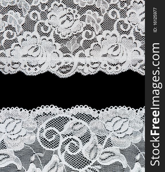 Decorative lace with pattern on black background. Picture is formed from several photographies