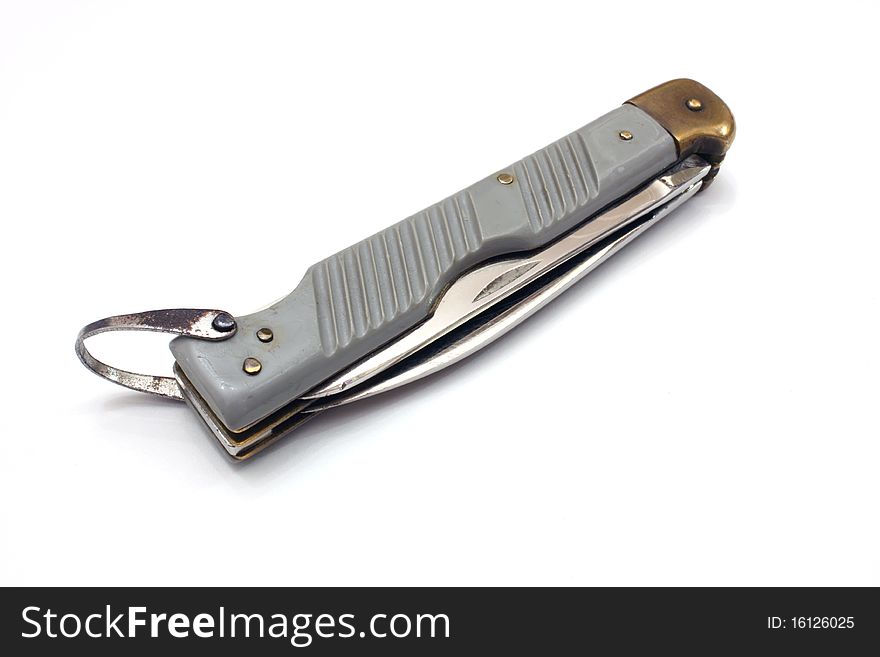 Aviation folding knife with an edge and a saw of gray color with a loop for fastening. Aviation folding knife with an edge and a saw of gray color with a loop for fastening