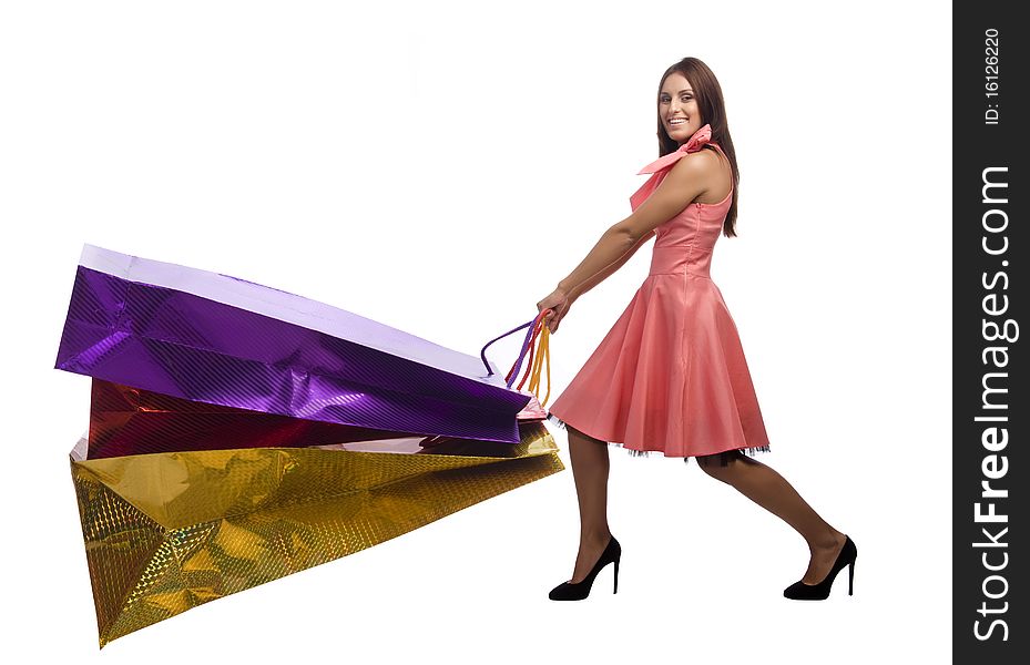 Young woman is drawing large paper bags with purchase. Young woman is drawing large paper bags with purchase