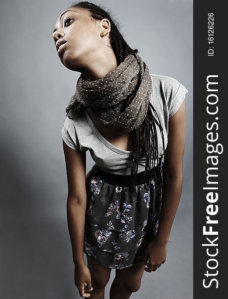 Beautiful African Woman Pose On Grey Background