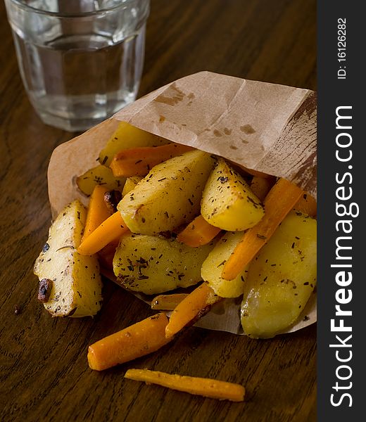 Roasted garlic potatoes and carrots with seasalt and rosemary. Roasted garlic potatoes and carrots with seasalt and rosemary.