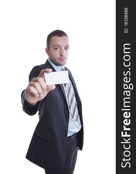 Young businessman is holding blank business card between two fingers. Young businessman is holding blank business card between two fingers