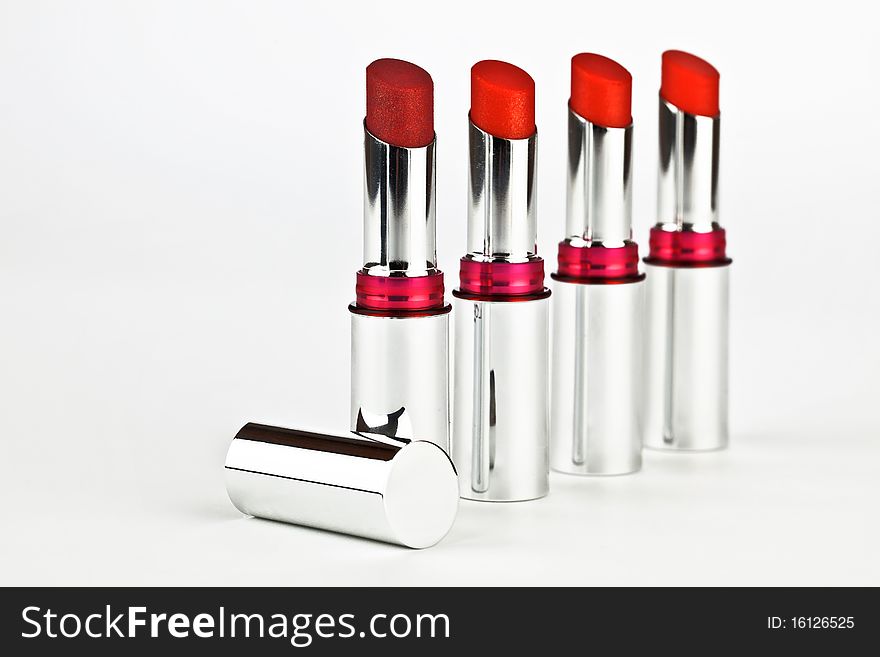 Four lipsticks in a crome case. Four lipsticks in a crome case.