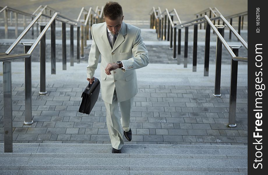 Portrait of businessman on the street near office. photo