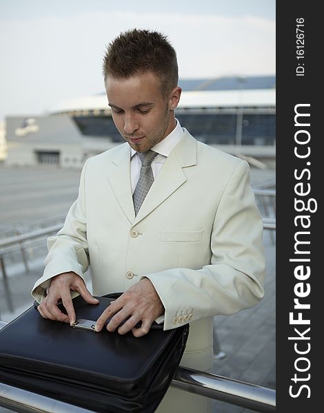 Portrait of businessman on the street near office. photo