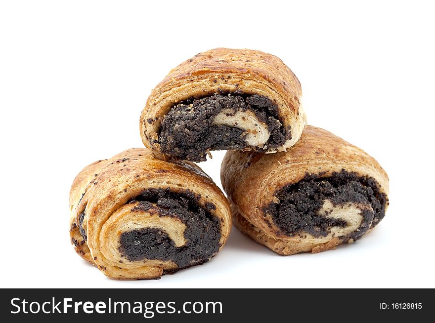 Croissant from flaky pastry with poppy on a white background