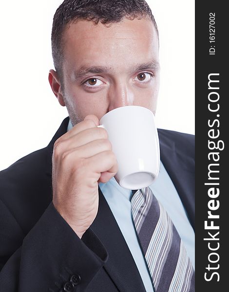 Businessman having cup of coffee and looking happy. Businessman having cup of coffee and looking happy